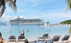 royal caribbean oasis class ship docked in labadee